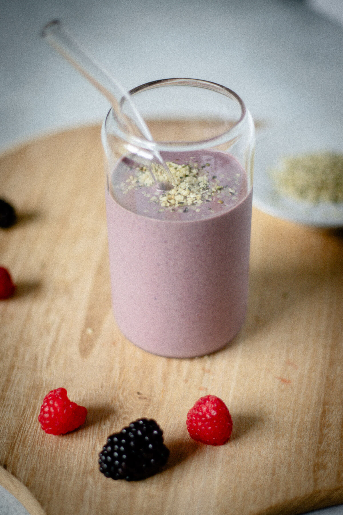 gut friendly triple berry smoothie with hemp seeds topping