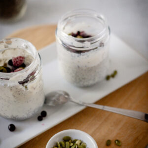 instant chia pudding with pumpkin seeds and berries on top