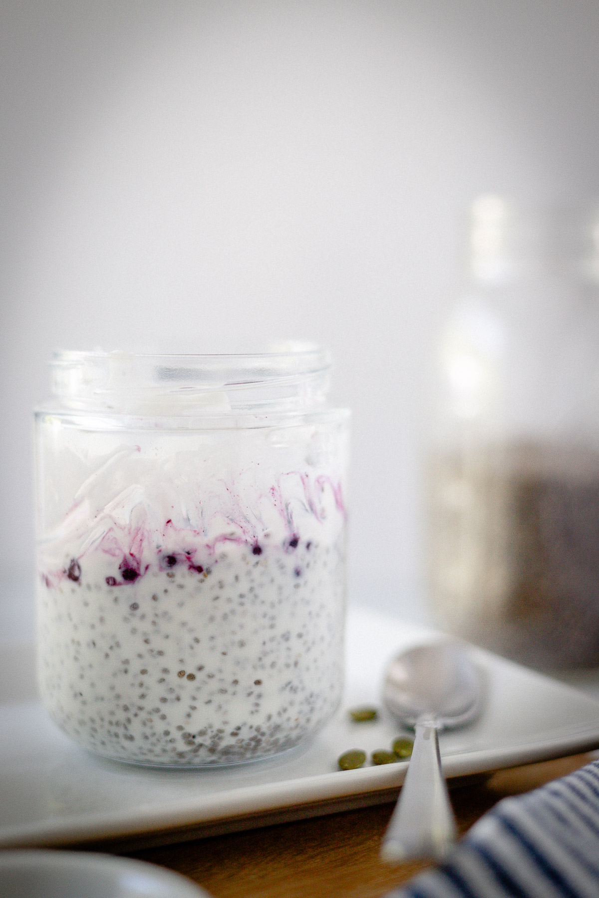 instant chia pudding with pumpkin seeds and berries on top