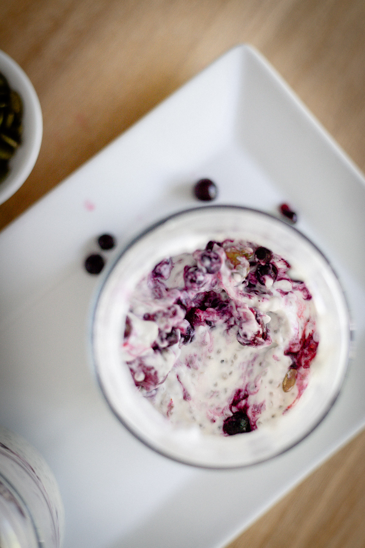 instant chia pudding with pumpkin seeds and berries on top
