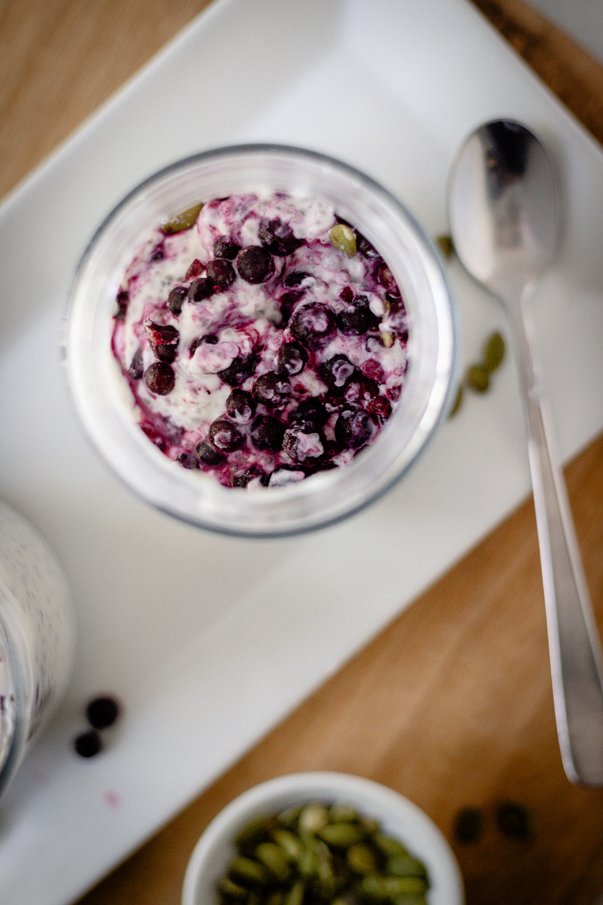 instant chia pudding with pumpkin seeds and berries on top