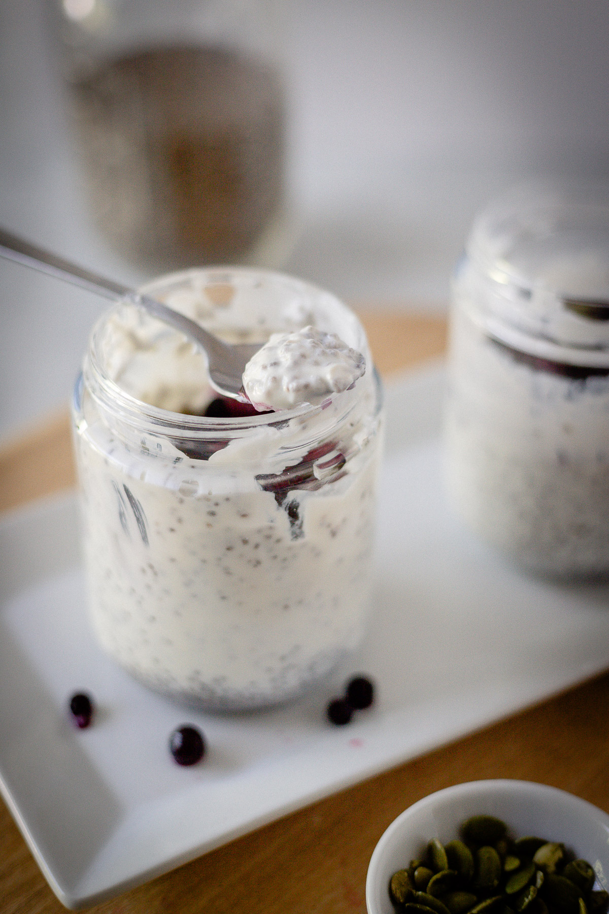 instant chia pudding with pumpkin seeds and berries on top
