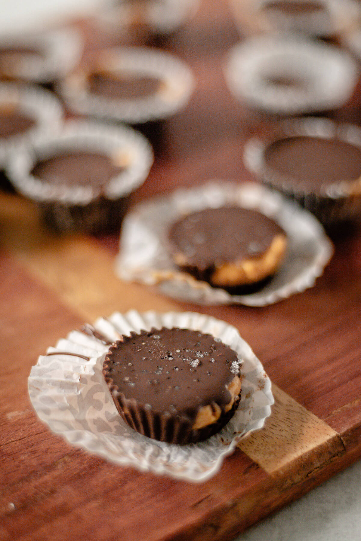 close up view of homemade chocolate peanut butter cups with sea salt topping