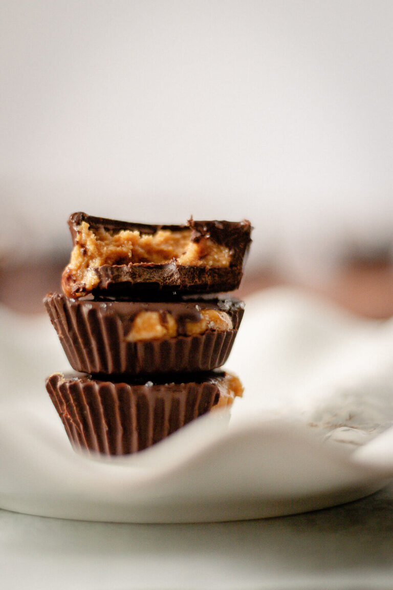 stack of homemade chocolate peanut butter cups with sea salt topping