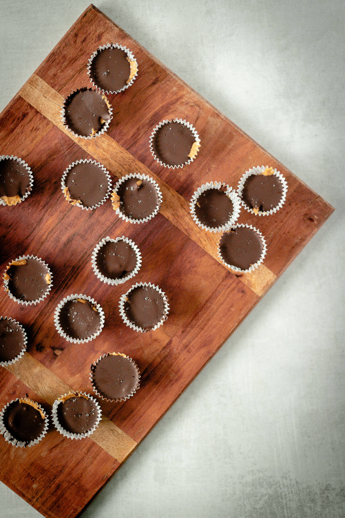 top down view of chocolate peanut butter cups on a cutting board
