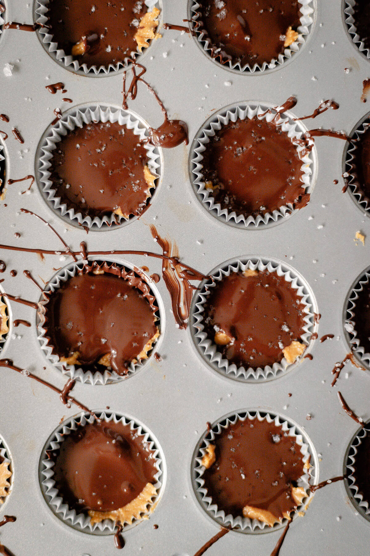 homemade chocolate peanut butter cups in a muffin tin