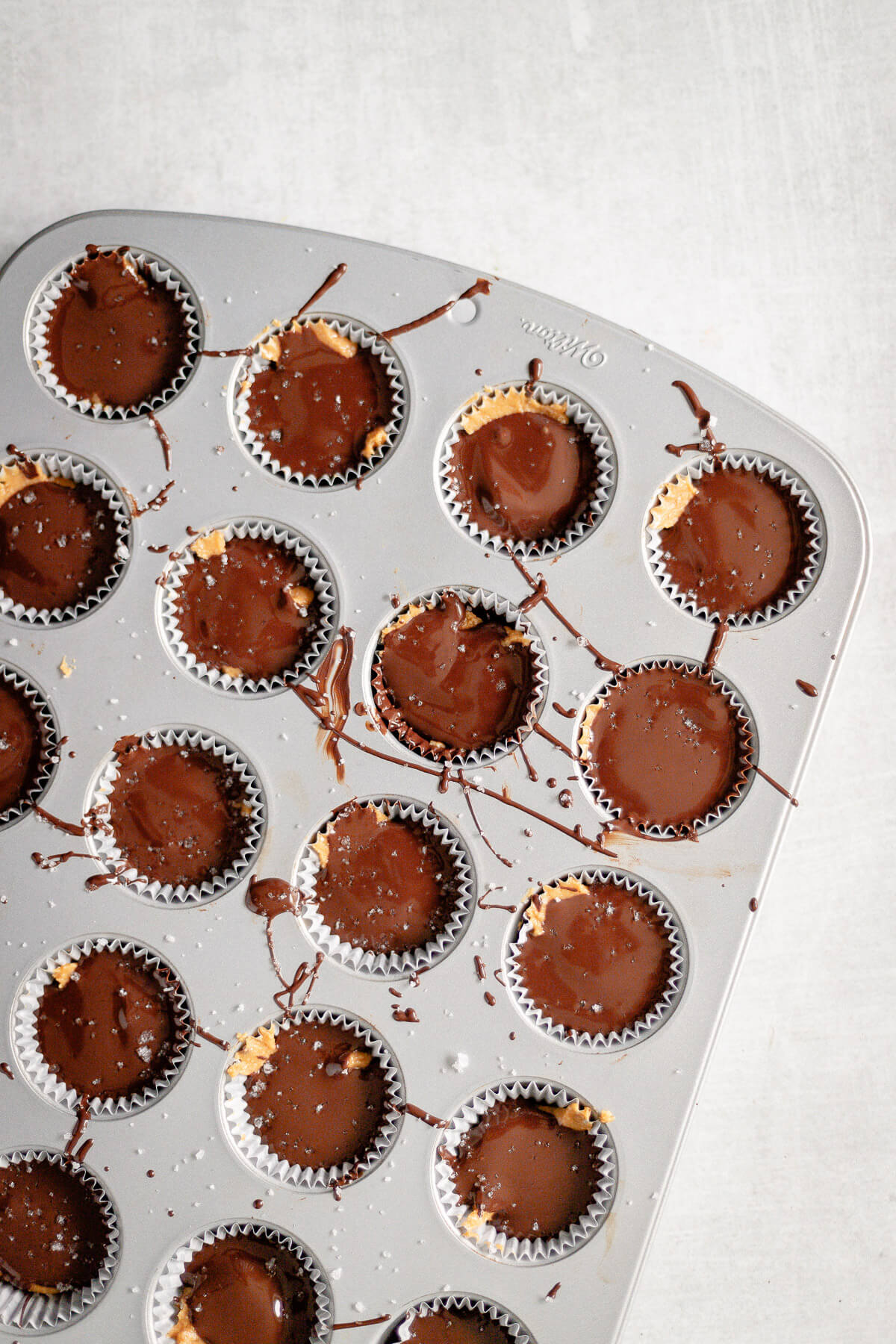 homemade chocolate peanut butter cups in a muffin tin
