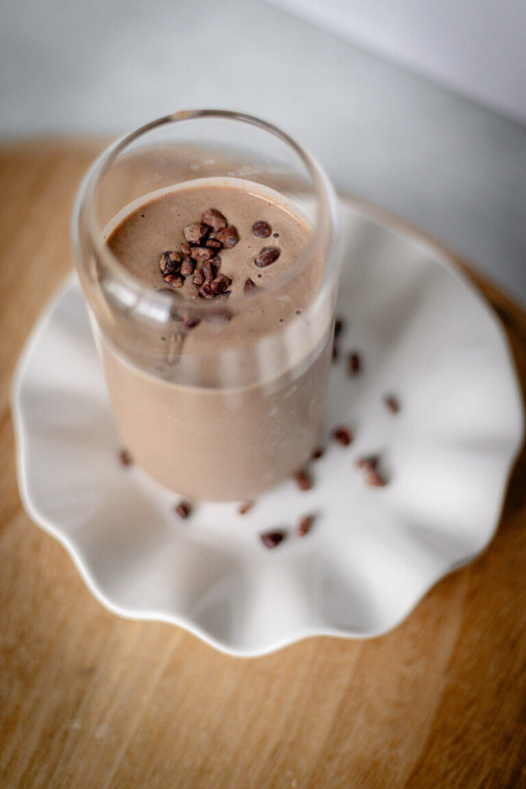 double chocolate protein smoothie with cacao nibs on top