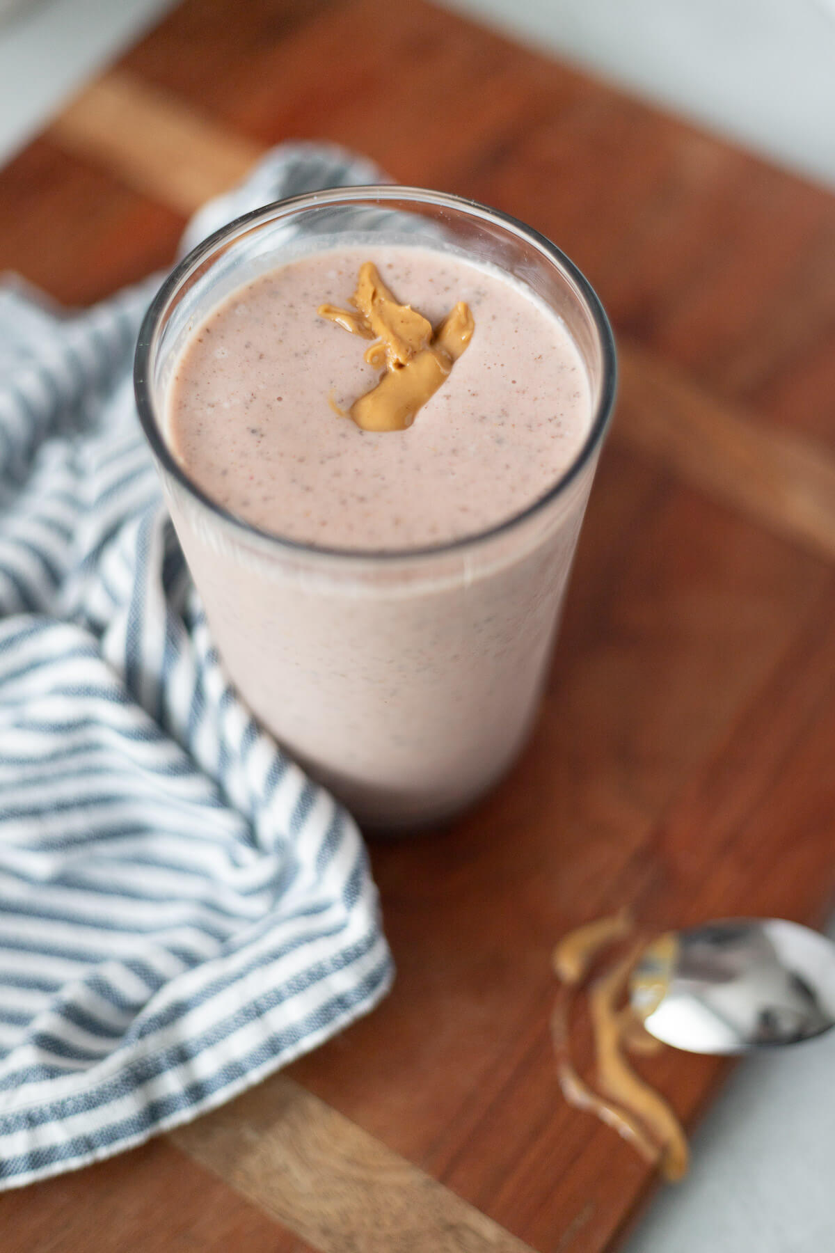 strawberry peanut butter protein smoothie in a glass