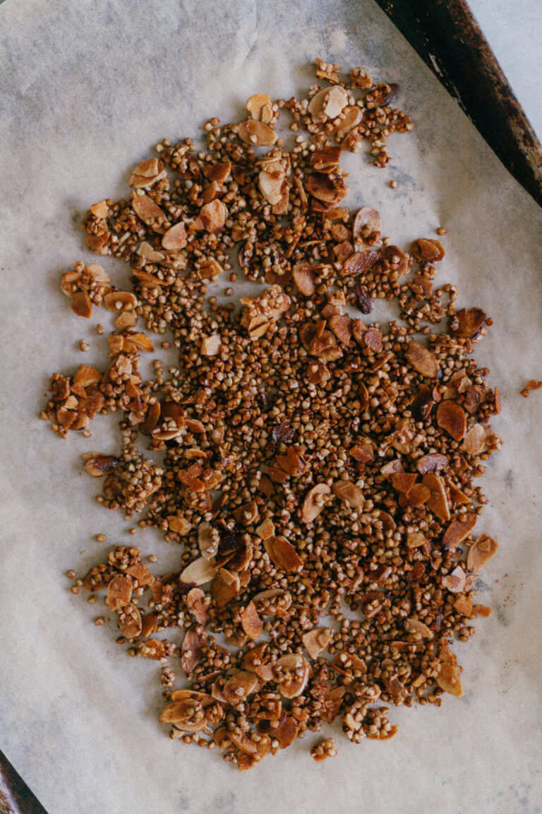 Buckwheat Groat and Almond Granola on a baking sheet with parchment paper