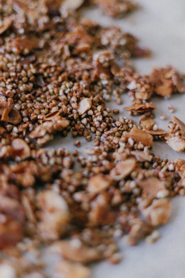 Almond Buckwheat Granola Close up of Buckwheat Groat and Almond Granola on a baking sheet with parchment paper