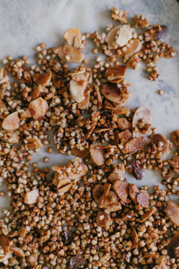 Almond Buckwheat Granola Close up of Buckwheat Groat and Almond Granola on a baking sheet with parchment paper
