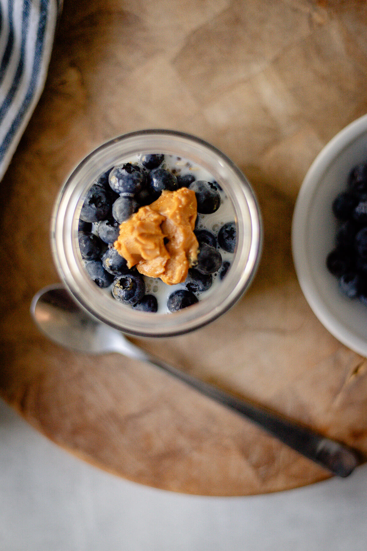 blueberry overnight oats with a dollop of peanut butter on top