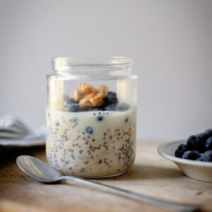 blueberry overnight oats with a dollop of peanut butter on top
