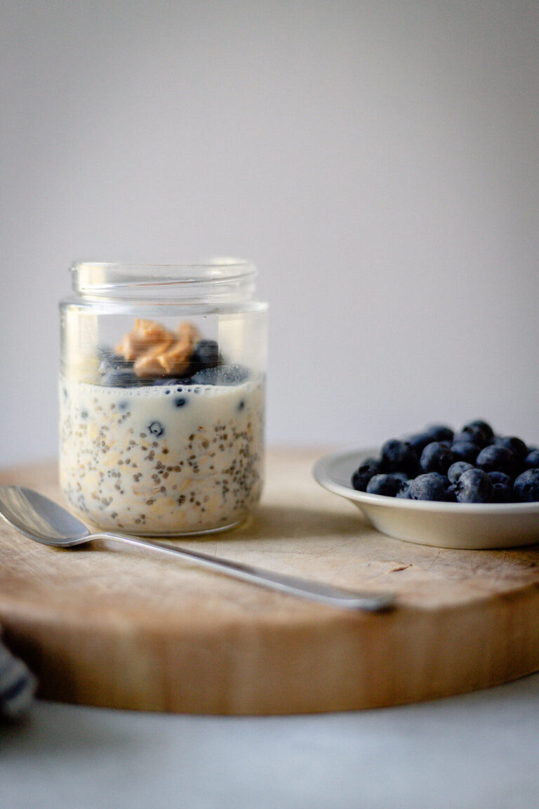 blueberry overnight oats with a dollop of peanut butter on top